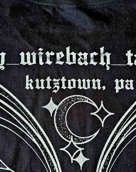 a photo of the back of an all over print showing the front collar through the back of the print