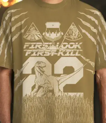 a photo of a white all over print on the front of the t-shirt with a dino and 22 on it. 