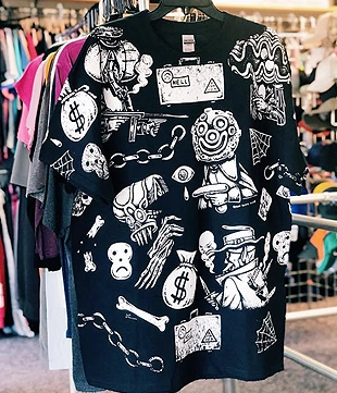 Black t-shirt with a busy, artistic collage print featuring money signs, skulls, and abstract iconography.