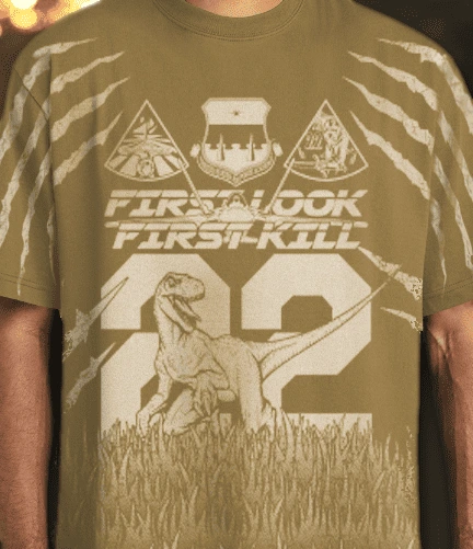 a photo of a white all over print on the front of the t-shirt with a dino and 22 on it. 