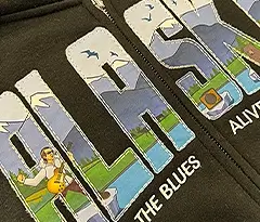 photo of an applique with custom printed fabric on the front of a full-zip hoodie