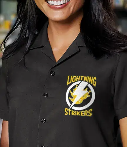 Women's black custom bowling shirt with embroidered Lightning Strikers logo on the left chest