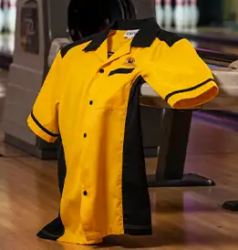 picture of a black and gold retro bowling shirt