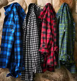 4 flannel shirts hanging on hooks