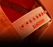 close-up of custom snapback hat closure with adjustment snaps