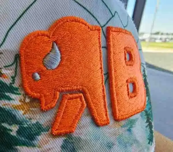 Closeup of orange buffalo 3d puff embroidery on custom trucker hat