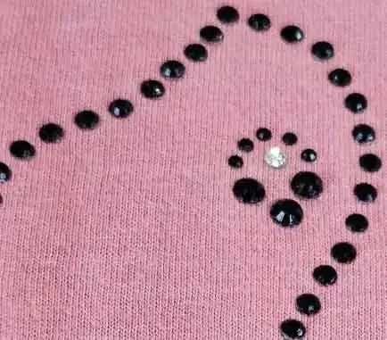 rhinestone design on a cheer and dance performance shirt