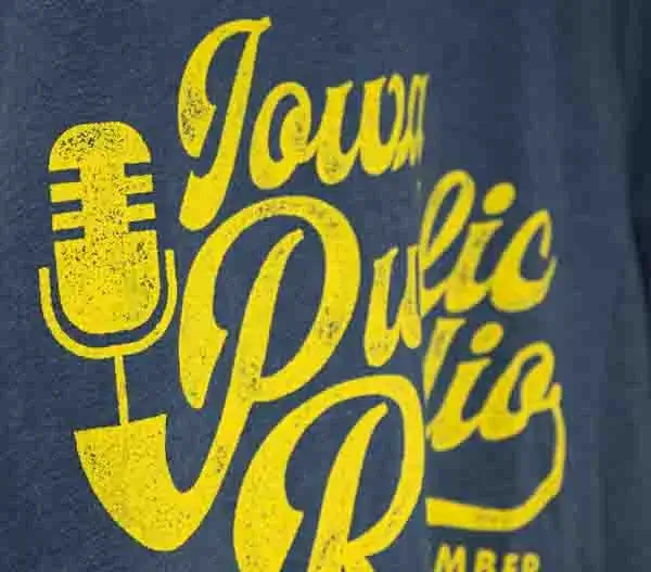 a yellow screen print on an indigo shirt
