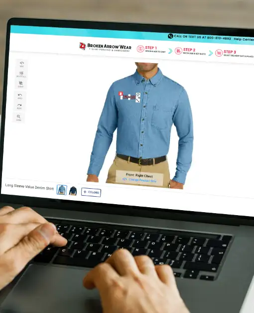 a photo of a person on a laptop creating a custom design on a denim shirt