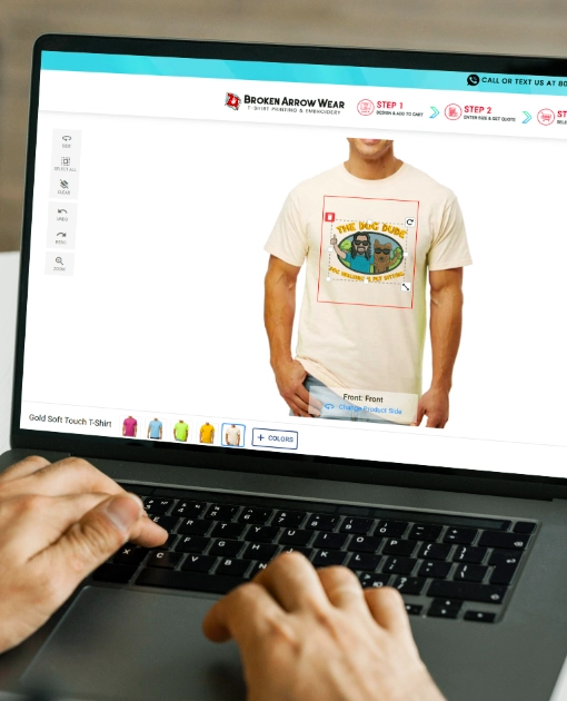 a photo of a person on a laptop designing a women's v-neck t-shirt in the BrokenArrowWear online design studio