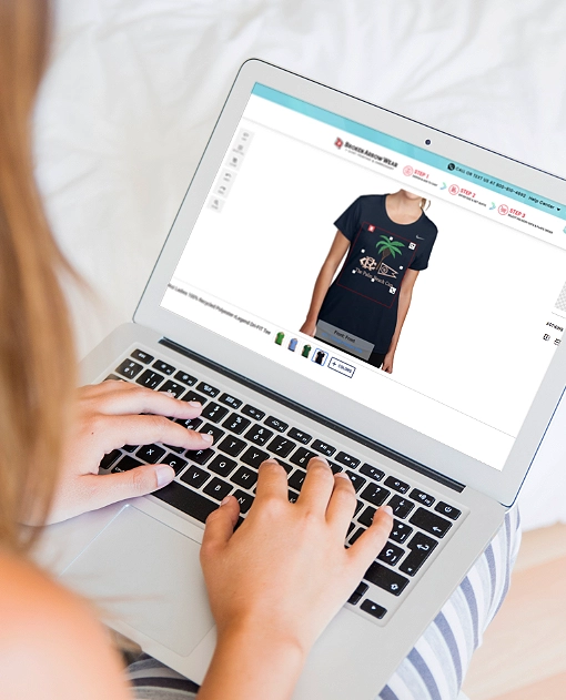 a photo of a person on a laptop designing a women's performance t-shirt in the BrokenArrowWear online design studio