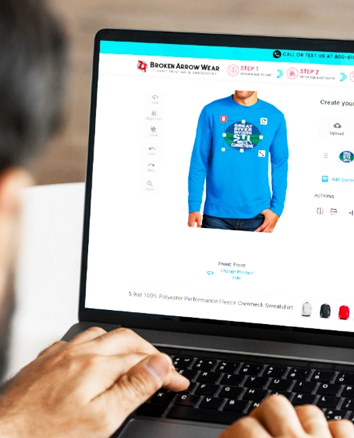 a person on a computer creating a polyester crewneck sweatshirt with a logo on it