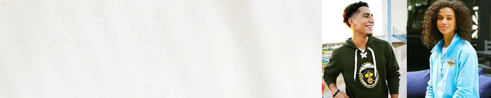 photo of a man and a women wearing hoodies that lace up with a custom design on them