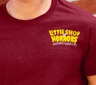 Custom logo printed on the right chest of a maroon t-shirt for Little Shop of Horrors.