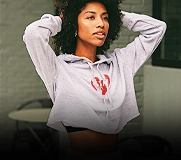 Woman wearing a light grey crop hoodie