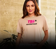 Woman wearing a graphic crop t-shirt with logo print in relaxed fit style