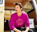 man wearing long sleeve pink t-shirt