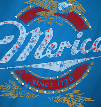 Patriotic Merica Since 1776 t-shirt graphic on blue fabric featuring an eagle, red and white stripes, and clear rhinestone embellishments.