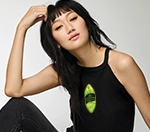 a woman wearing a black tank top wtih a custom design