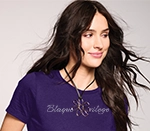 women wearing a purple t-shirt with a rhinestone design on it