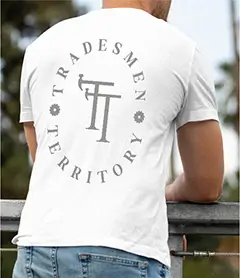 pBack view of a white crewneck t-shirt with a Tradesmen Territory reflective circular logo featuring hammer icons.