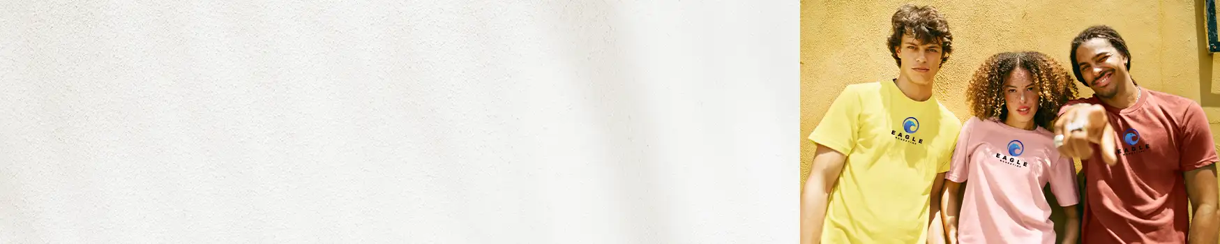 Smiling family of three generations wearing matching custom t-shirts, posing on a porch with greenery in the background, celebrating a family reunion.